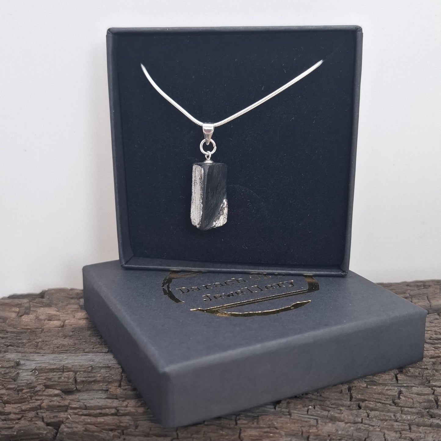 Fionnuala - Irish bog oak with fine silver leaf and sterling silver chain