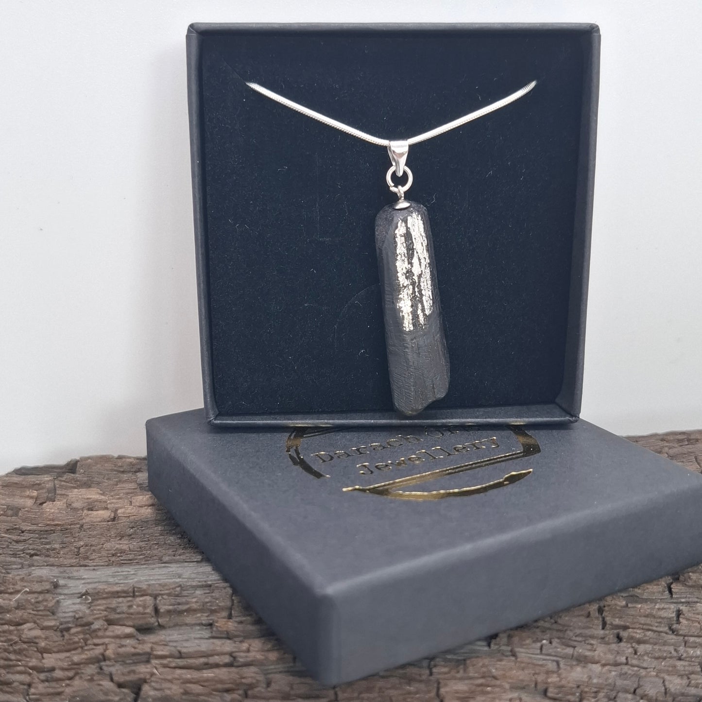Pendant made out of irish bog oak finished with gold or silver leaf and necklace