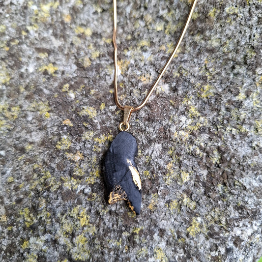 Pendant made out of irish bog oak finished with gold or silver leaf and necklace