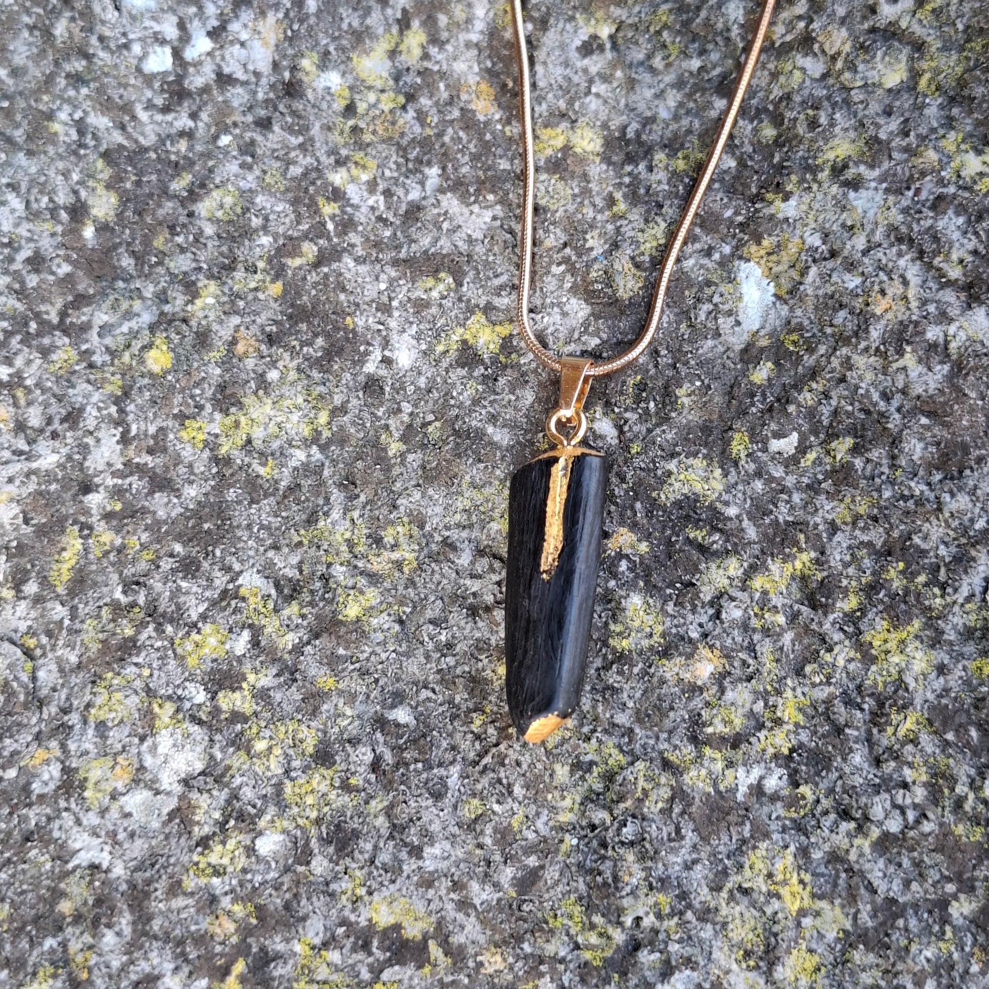 Pendant made out of irish bog oak finished with gold or silver leaf and necklace