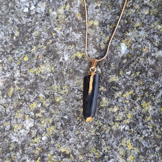 Pendant made out of irish bog oak finished with gold or silver leaf and necklace