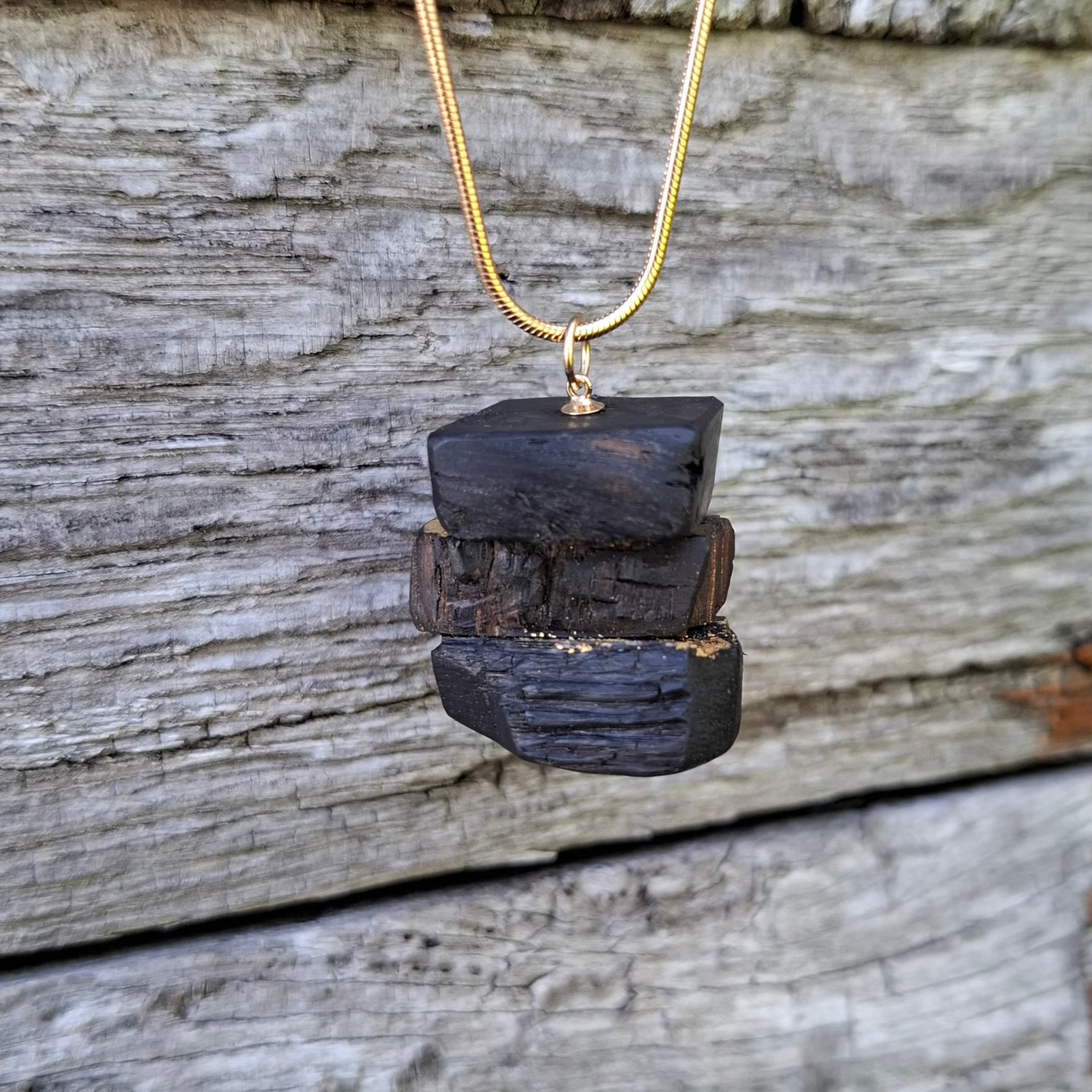 Turf Footin II - Irish bog oak necklace with 23.75ct gold leaf