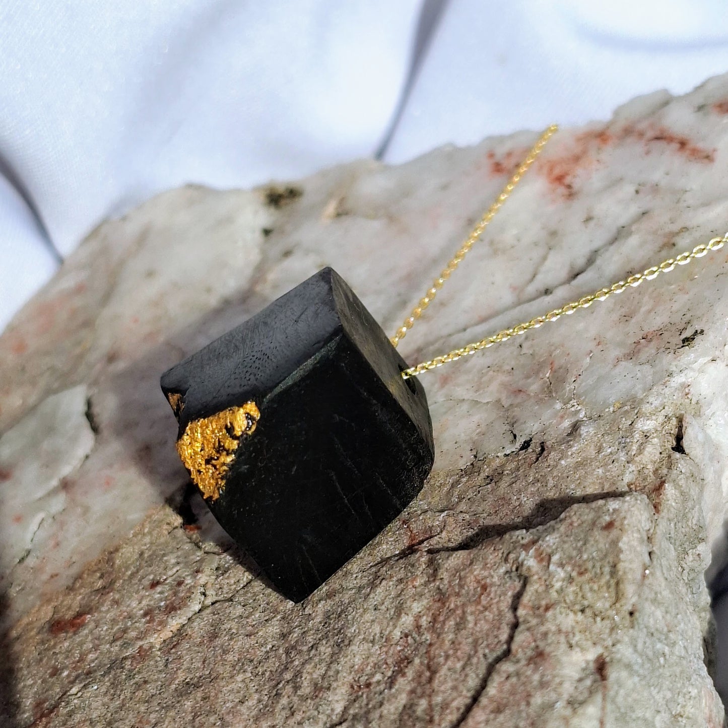 Scáil Óir - Irish bog oak pendant with 23.75kt gold leaf