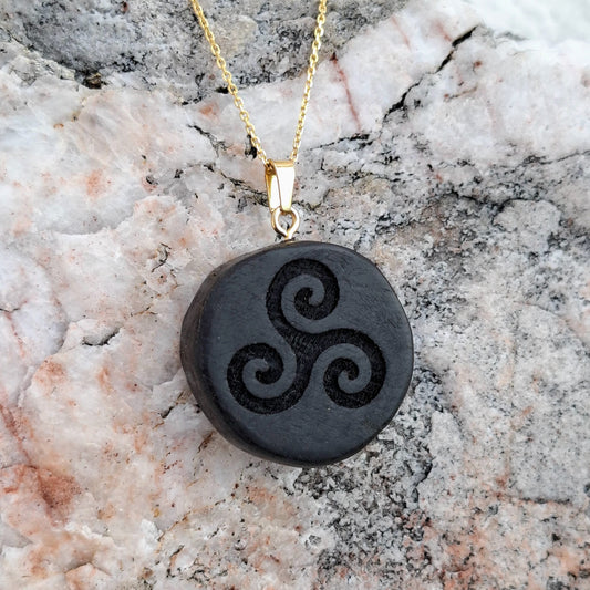 Bog oak wooden pendant with triskelion symbol