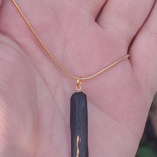 Pendant made out of irish bog oak finished with gold or silver leaf and necklace