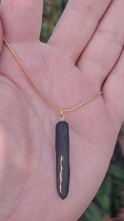 Pendant made out of irish bog oak finished with gold or silver leaf and necklace