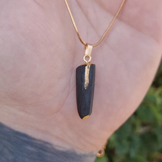 Pendant made out of irish bog oak finished with gold or silver leaf and necklace