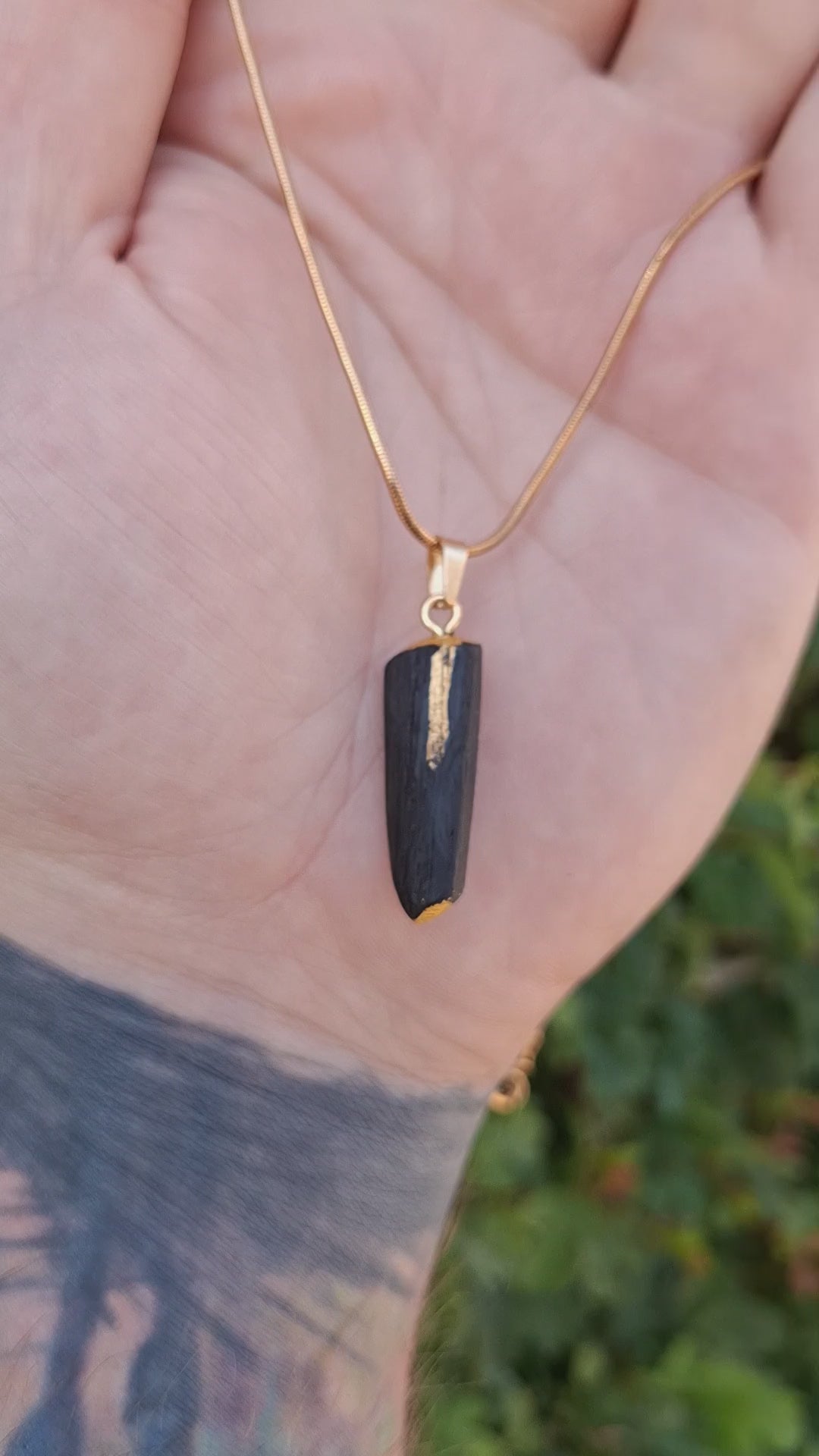 Pendant made out of irish bog oak finished with gold or silver leaf and necklace