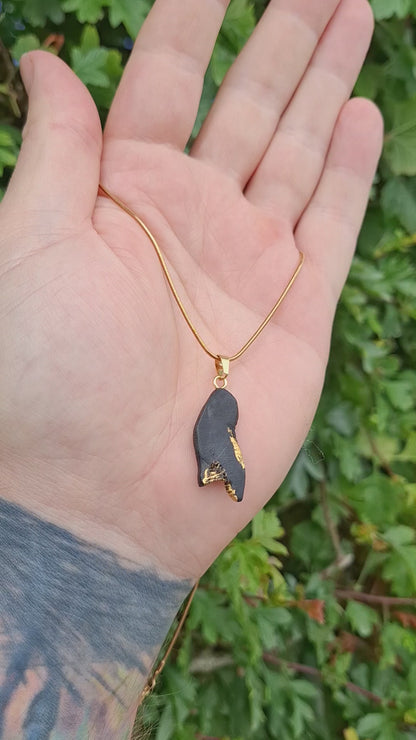 Pendant made out of irish bog oak finished with gold or silver leaf and necklace