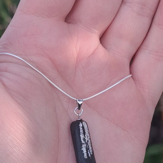 Pendant made out of irish bog oak finished with gold or silver leaf and necklace