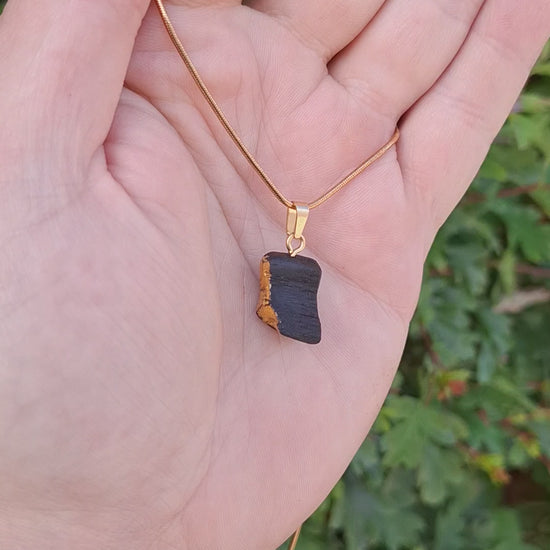 Pendant made out of irish bog oak finished with gold or silver leaf and necklace