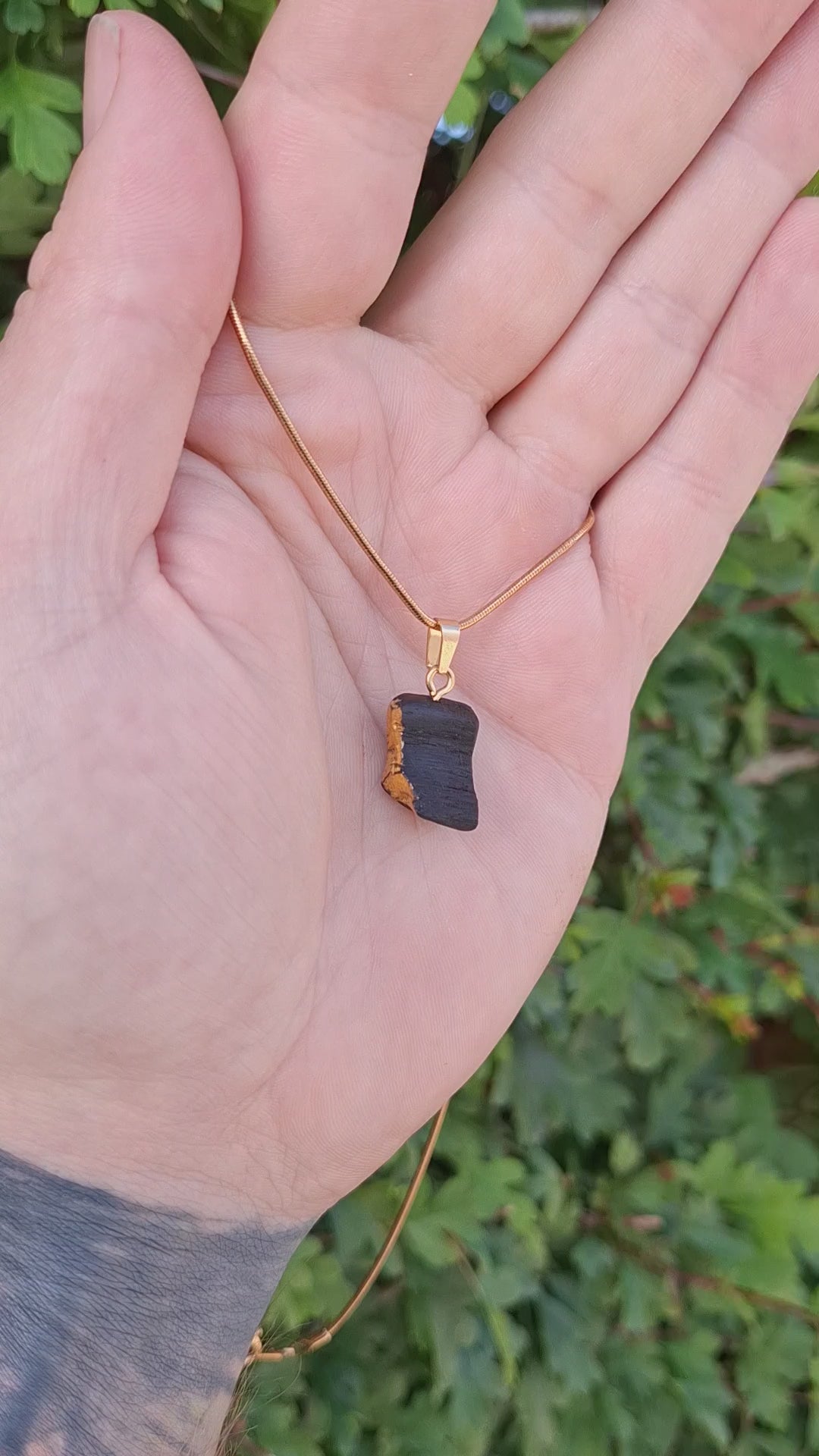 Pendant made out of irish bog oak finished with gold or silver leaf and necklace