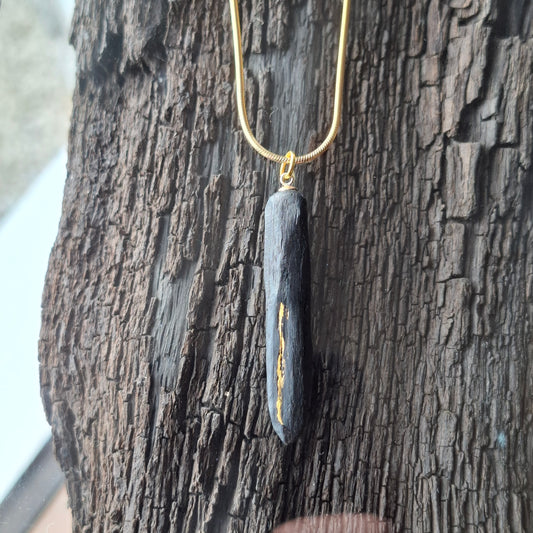 Pendant made out of irish bog oak finished with gold or silver leaf and necklace