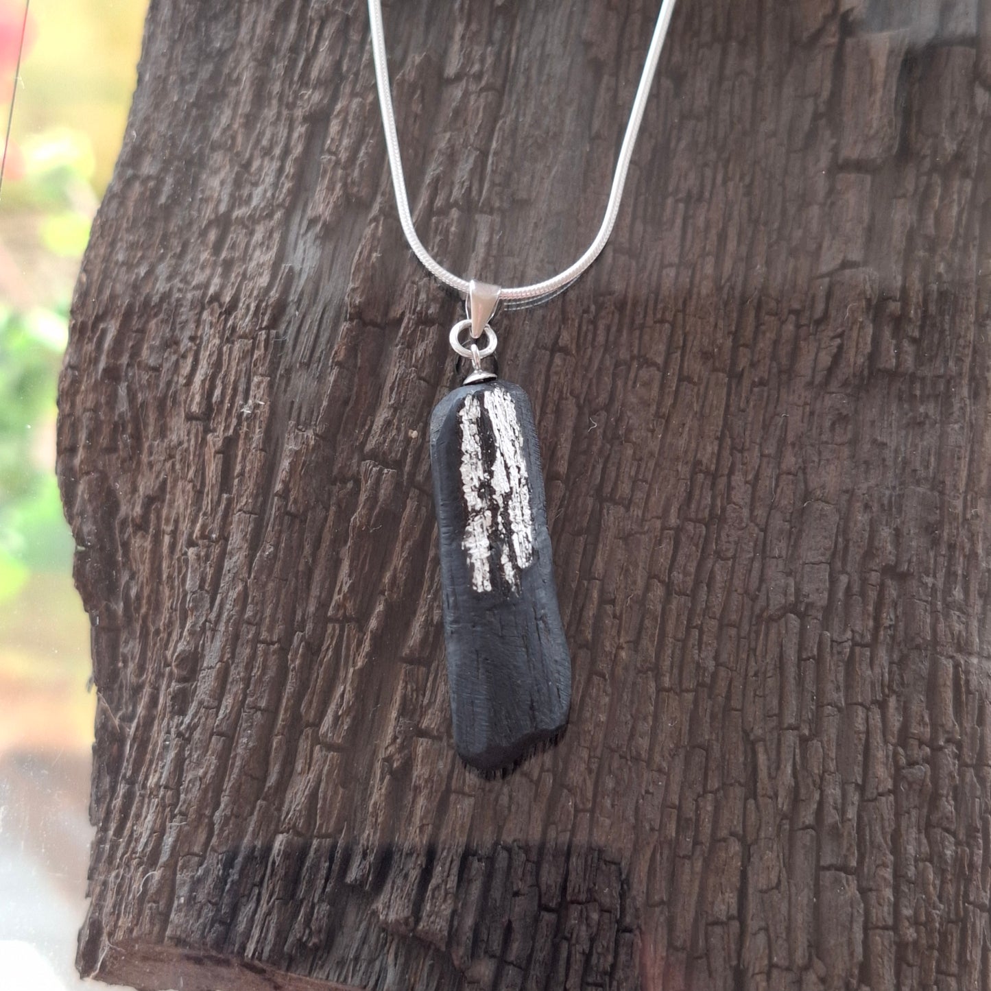 Pendant made out of irish bog oak finished with gold or silver leaf and necklace