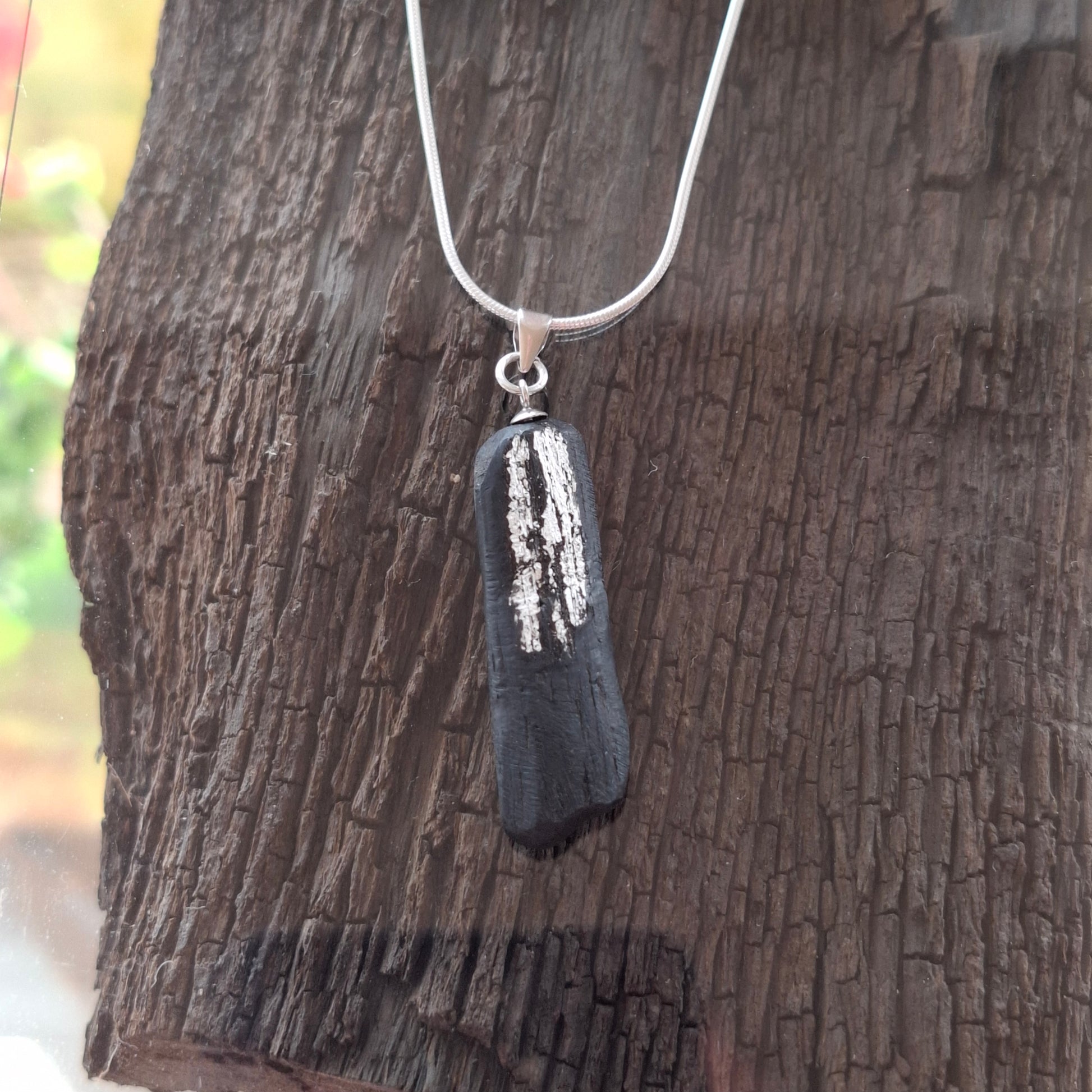 Pendant made out of irish bog oak finished with gold or silver leaf and necklace