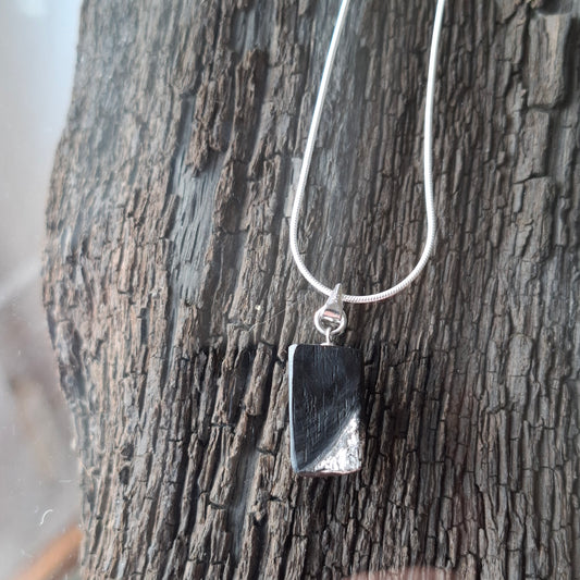 Fionnuala - Irish bog oak with fine silver leaf and sterling silver chain