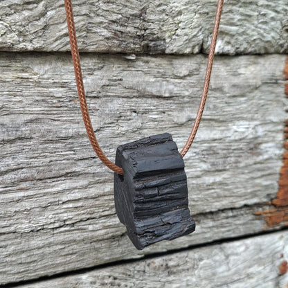 Portach  - Various Irish bog oak pendants with cord necklace
